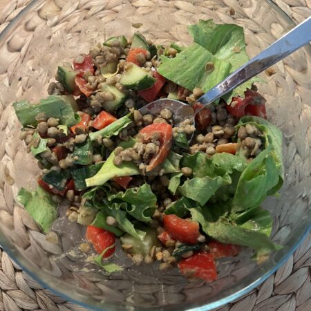 salad with brown lentils, red bell pepper, cucumber, creamy peanut tahini dressing,